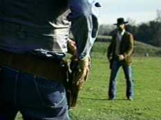 Cowboys about to draw their pistols.