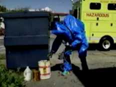 Haz Mat worker testing material.